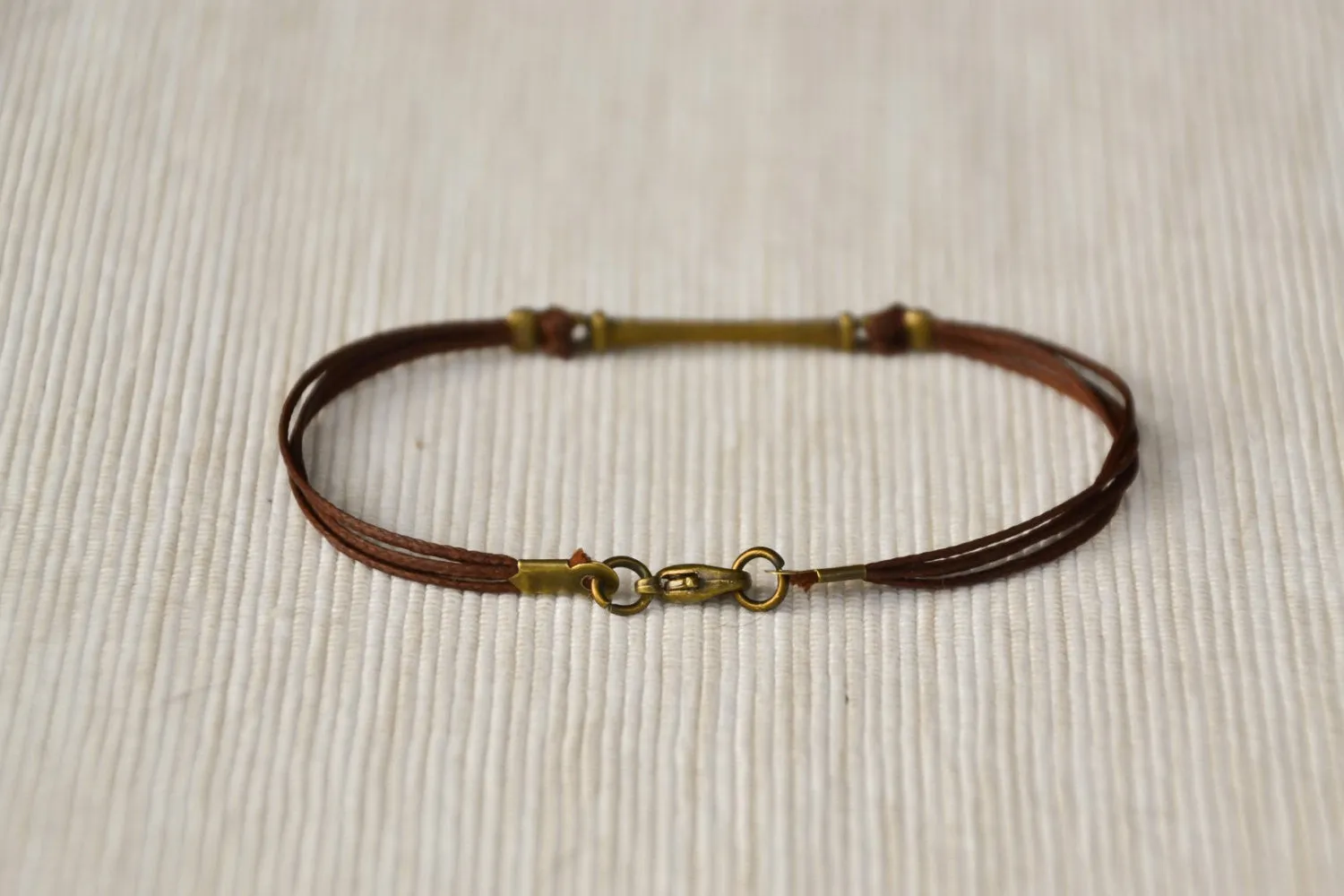 Brown cord bracelet for men with long bronze bar