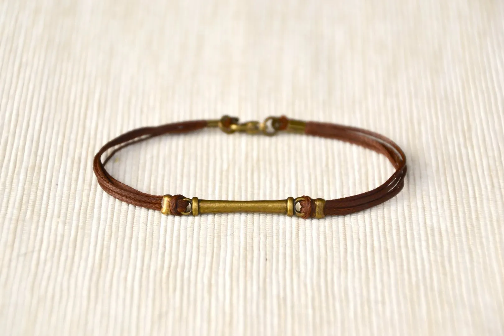 Brown cord bracelet for men with long bronze bar